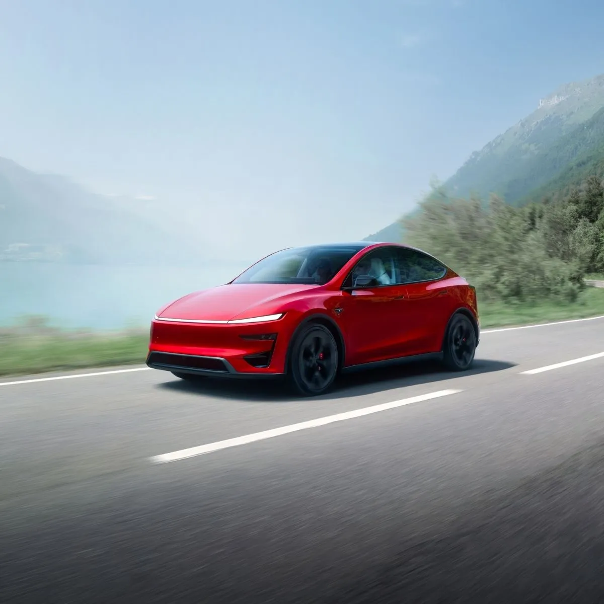 Tesla aumenta preço do Model Y em 1.000 euros 2 Tesla Model Y vermelho em estrada de montanha